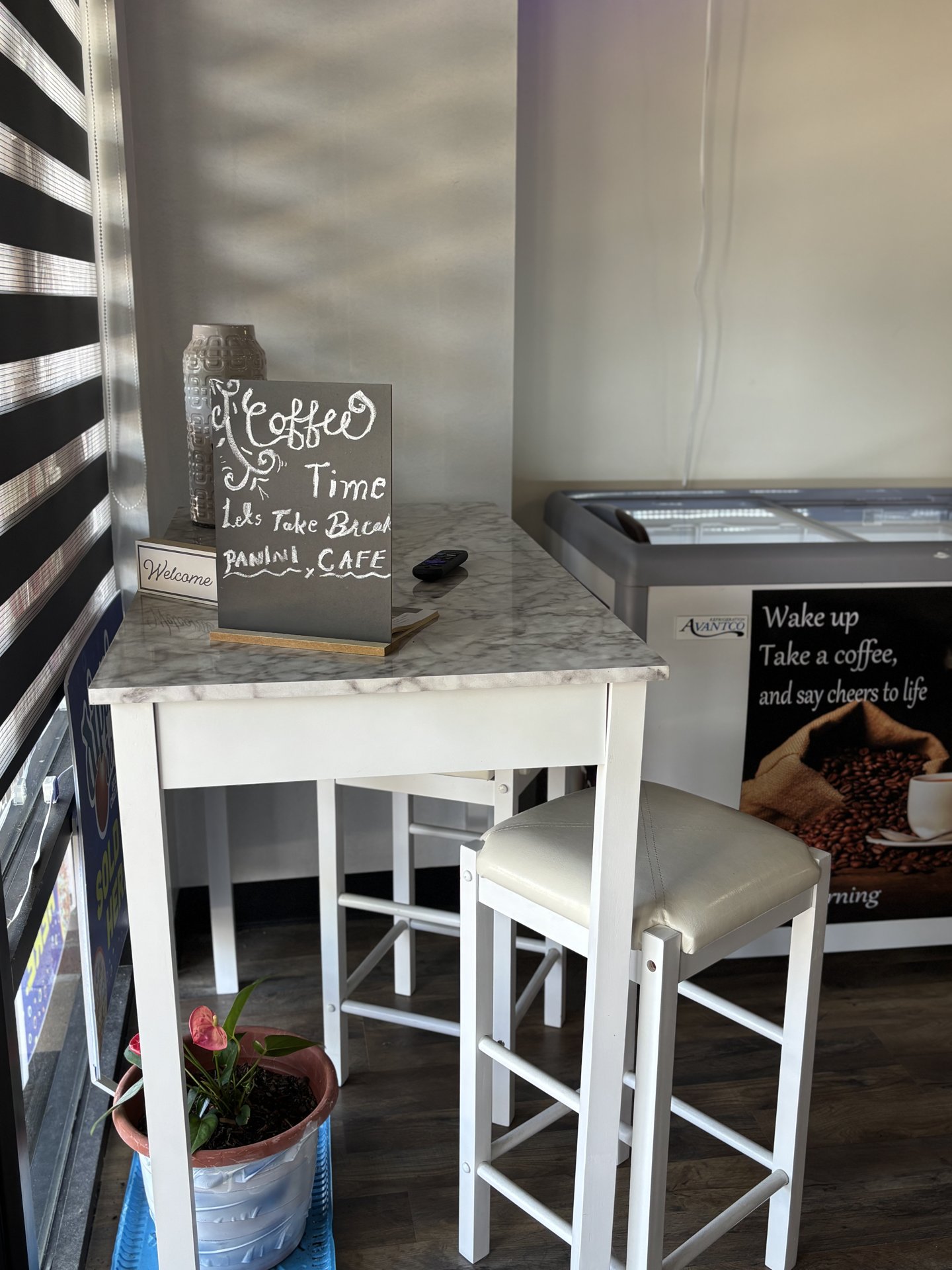 Marble-top bistro table with 'Coffee Time' chalkboard sign